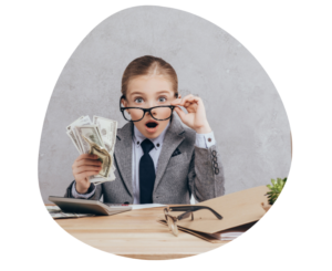Child holding money to represent childcare tuition rates and daycare pricing decisions