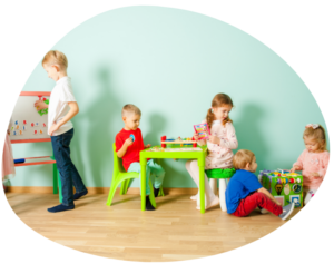 Children in a childcare classroom representing tuition rates and classroom staffing costs