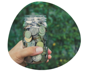 Jar of coins representing tight childcare center margins from tuition priced too low